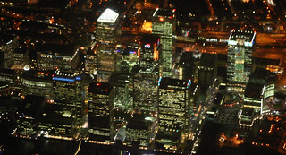 Canary Wharf By Night From The Air, London, England.