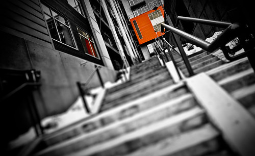 windows winter blackandwhite bw orange reflection building metal wisconsin architecture stairs canon concrete midwest dof angle cement steps perspective january madison 5d railing 2009 canonef1740mmf4lusm 309 selectivecolor 17mm canoneos5d flickrexplore westwash westwashington lowpointofview capitolwest lorenzemlicka 2009challenge