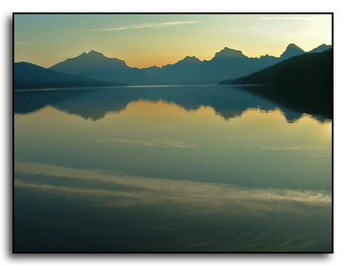 reflection silhouette sunrise montana glaciernationalpark lakemcdonald