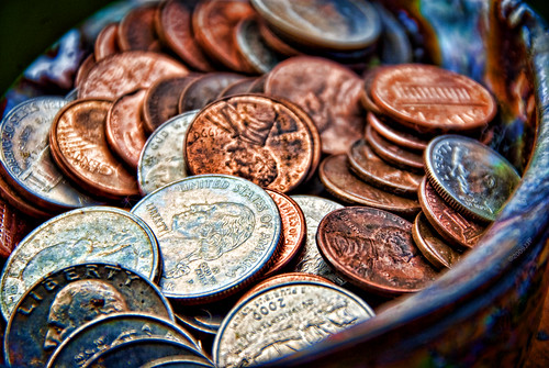 Piggy bank full of dirty  coins