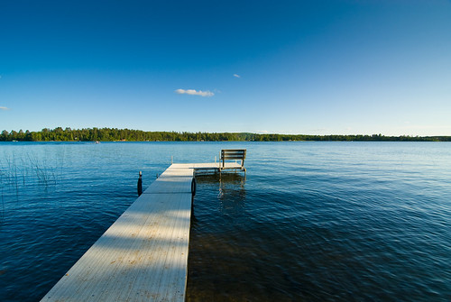blue sky house lake water minnesota dock cabin calm