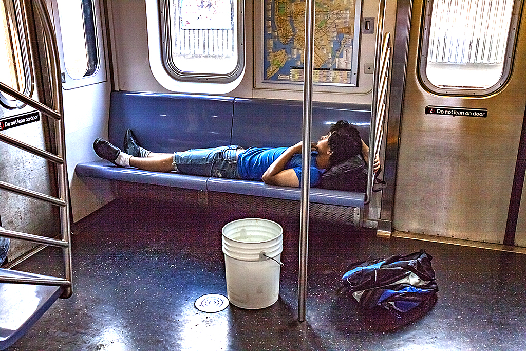 Man-sleeping-on-subway--Bronx