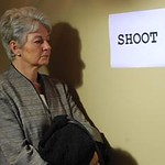 The sign says "SHOOT"
