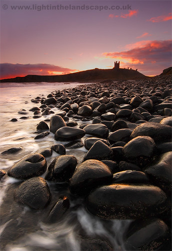 uk sea england castle beach sunrise canon coast boulders northumbria dunstanburghcastle