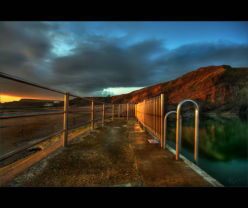 ocean sunset red sea green wet pool sign rock fence reflections evening sand rocks cornwall notice dusk ripple horizon steps wave pebbles cliffs atlantic swimmingpool canon350d nodiving puddles railings emerald hdr cloudformation sunray foreground whiteline deepend bude rockformation seapool photomatix crooklets leadinline summerleaze