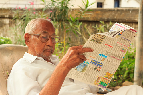people reading newspaper