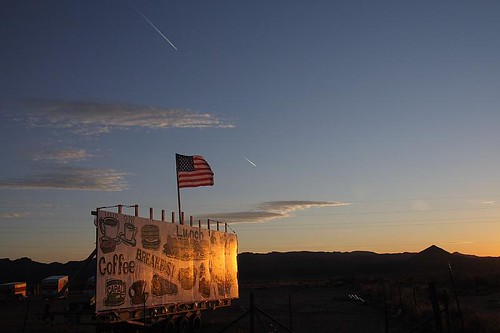 sunset arizona sky sign store contrail flag chloride