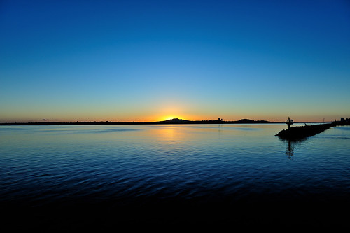 newzealand auckland westhaven marina rangitoto volcano sunrise ocean water sky orange blue aotearoa clear day
