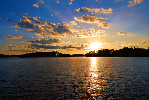 blue sunset sky sun sunlight lake wisconsin clouds gold sunrays tomahawkwi