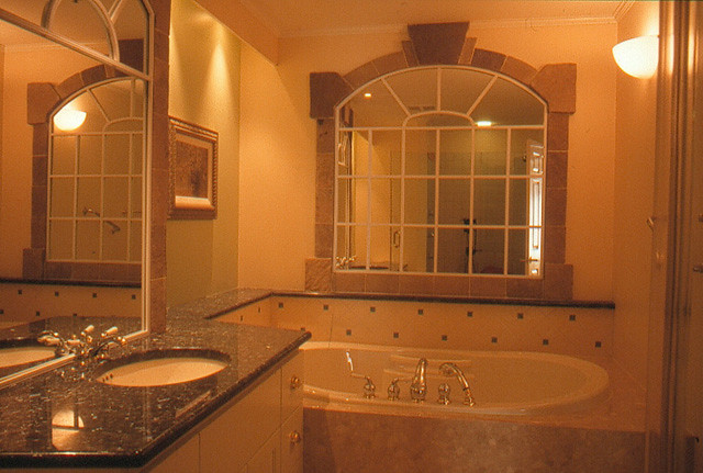 Mirror as a window in this indoor en-suite bath.