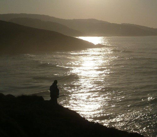 sol contraluz mar acantilado rocas pescador brillos flickrdiamond