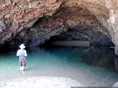 daniel exploring a tidal cave in search of a camping… 