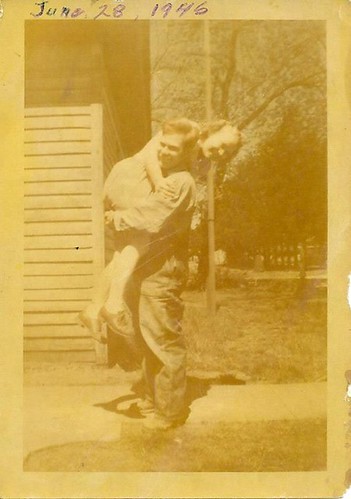 Grandpa carrying Grandma over his shoulder