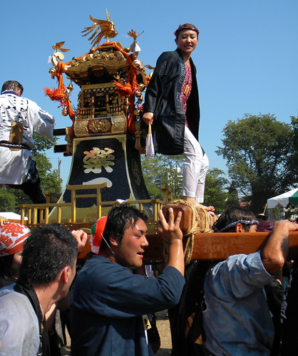 carrying the Powell St. Festival Japanese Shrine