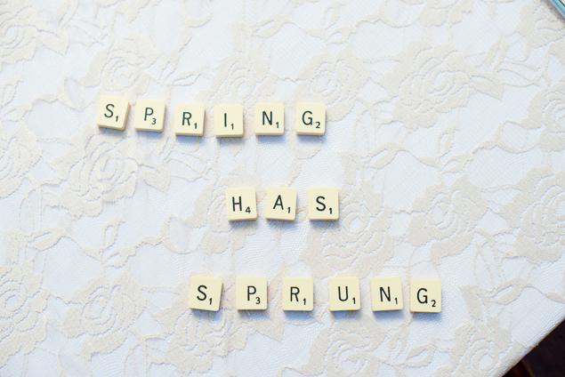 Spring has sprung spelled with scrabble letters