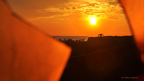 morning sea sky orange sun broken clouds sunrise