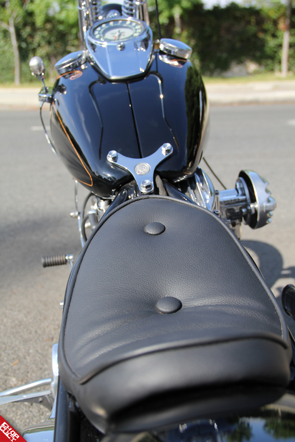 A close up of the bike's seat and the bike's black tank