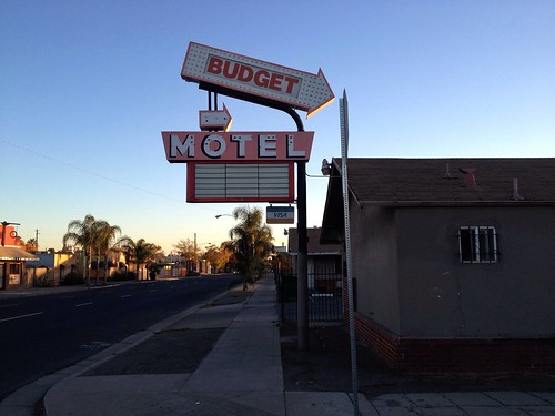 street city urban sign landscape evening neon view budget lodging postcard scenic motel reststop tourist lodge traveller arrow pointing vacancy cheap stockton ontheroad passingthrough visa outskirts seedy signofthetimes flophouse notellmotel hitel roomstolet