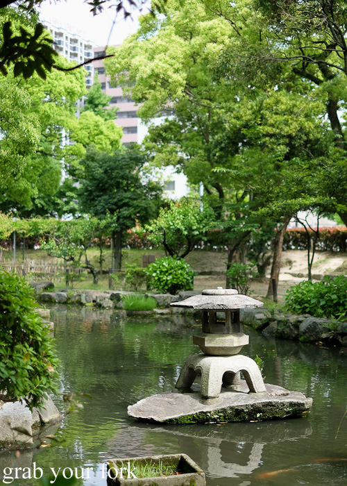 Tranquil koi carp pond and gardens at the Sumiyoshi Shrine in Hakata, Fukuoka, Japan
