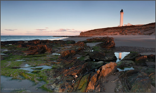 sunset sea lighthouse reflection beach water pool rock scotland sand moray firth lossiemouth covesea