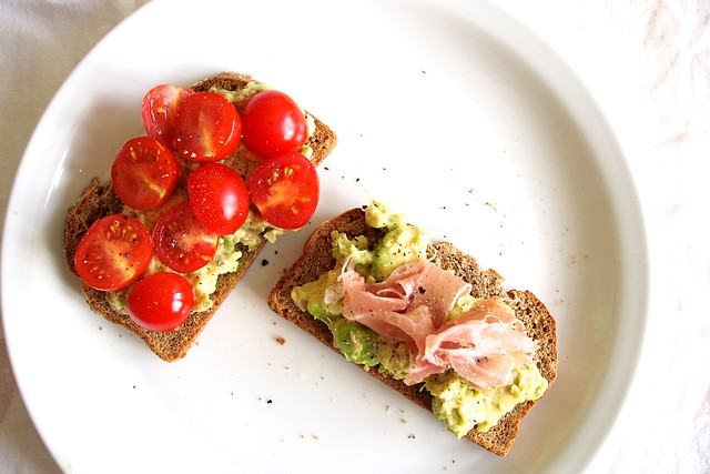 avocado toast with cherry tomatoes and prosciutto