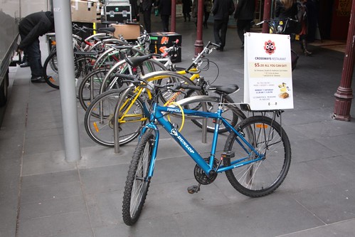 Another bicycle parked on Swanston Street, positioned for advertising purposes