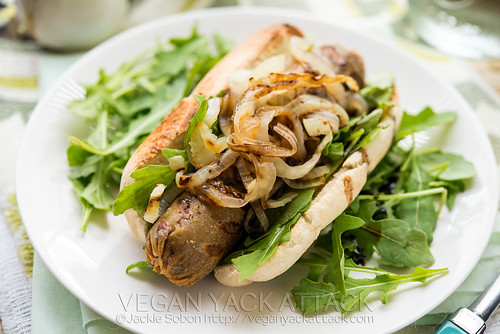 These apple fennel seitan dogs are a summertime necessity! Grilled onions and fennel, fresh arugula, and a homemade seitan sausage recipe. 