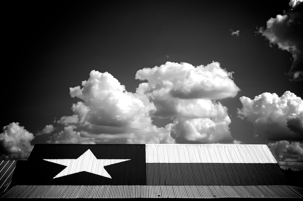 Star of Texas Flag on a hot Tin Roof with blue sky, photography art, for home and office décor. Title is: 132