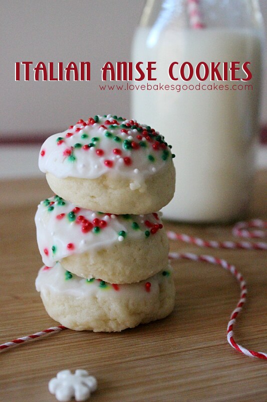 Italian Anise Cookies stacked up with a glass of milk.