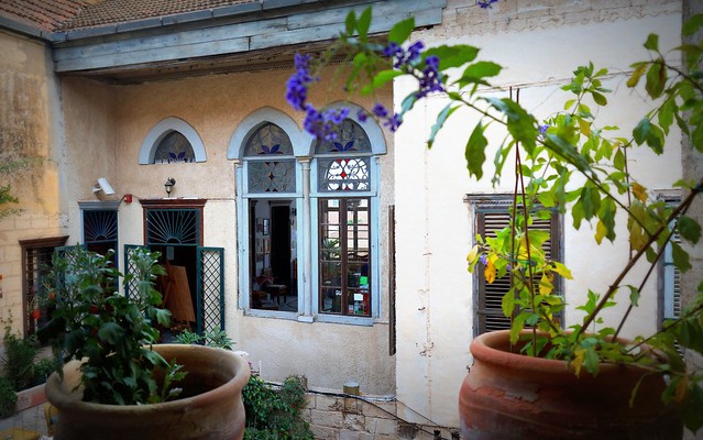 Nazareth Fauzi Azar Inn in the courtyard area with flowerpots in Israel 