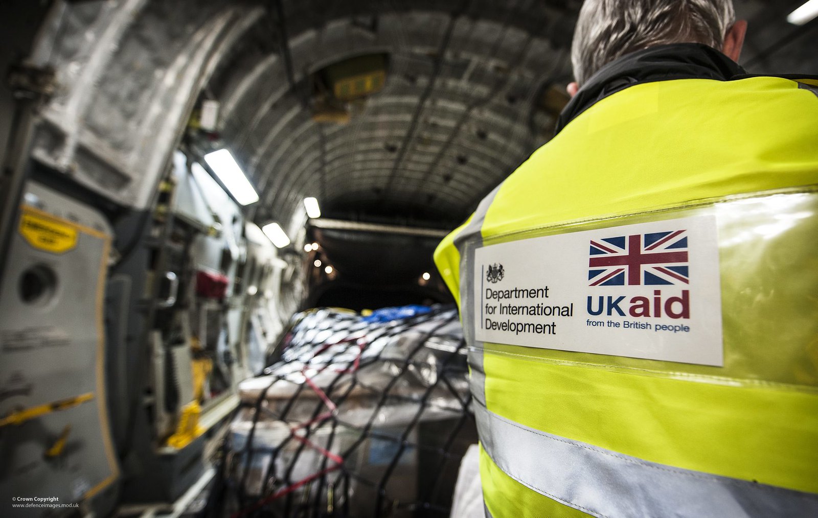 DfID worker checking supplies on a RAF C17 bound for the Philippines