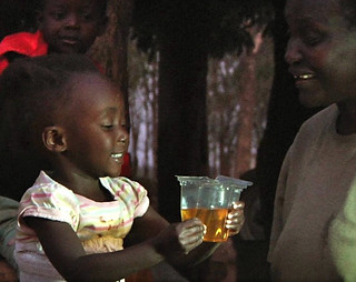 Child drinking ORS from Kit Yamoyo