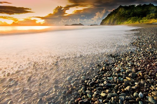 ocean longexposure seascape beach nature water sunrise indonesia landscape rocks southeastasia stones tide pebbles shore sulawesi oceania asiapacific centralsulawesi