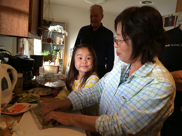 Mio making rolls with Grandma