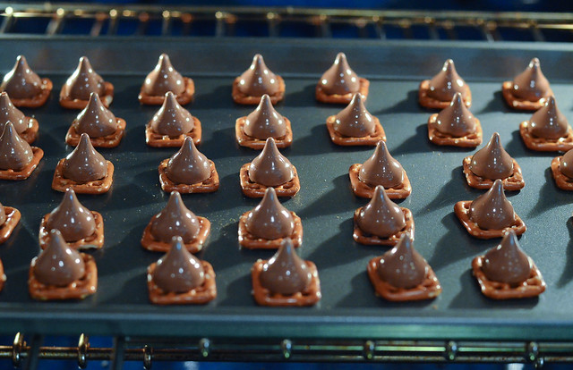 The Pretzel Candies on a baking sheet in the oven.