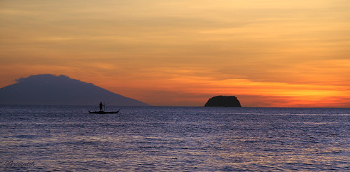 sunset sea sky mountain water island boat fisherman philippines