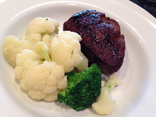 Filet mignon with steamed cauliflower and brocolli