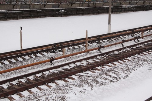Third rail running down the middle of the two tracks