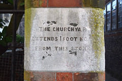 the churchyard extends 1 foot north from this stone