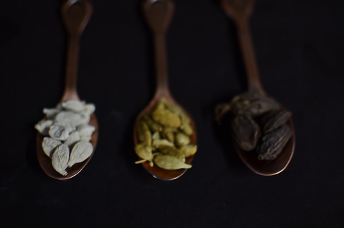 The cardamom pod lineup: white, green and black/brown