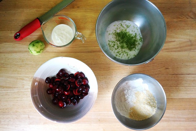 Light and airy cherry cake, deconstructed: ingredients laid out in bowls in an overhead shot