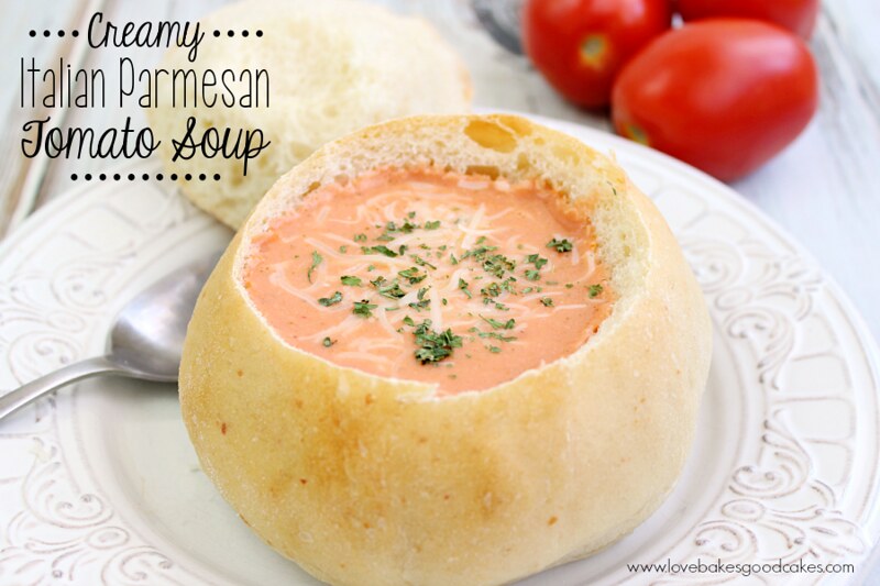Easy Cooking with Slow Cooker Creamy Italian Parmesan Tomato Soup bowl on a white plate with a spoon close up.