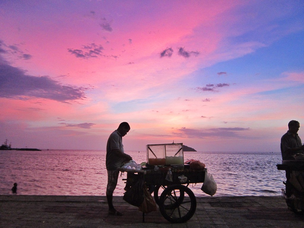 A pink sunset at the beach in Santa Marta, Colombia
