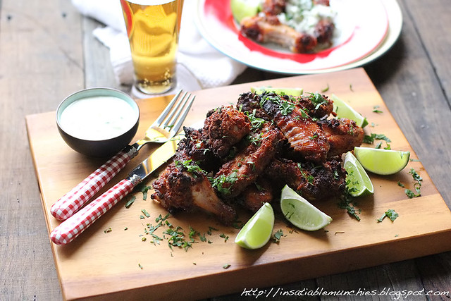 Beer brined chicken wings, with a dusting of spices to create a crust. With lime wedges to serve. 