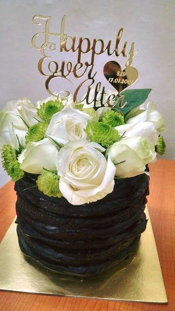 Pure chocolate naked cake decorated with fresh white roses by Suraksha Chainani of SSD Box of Delights