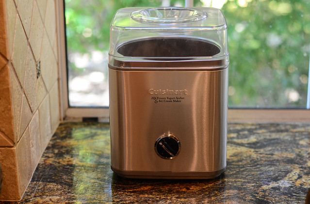 An ice cream maker on a kitchen counter top.