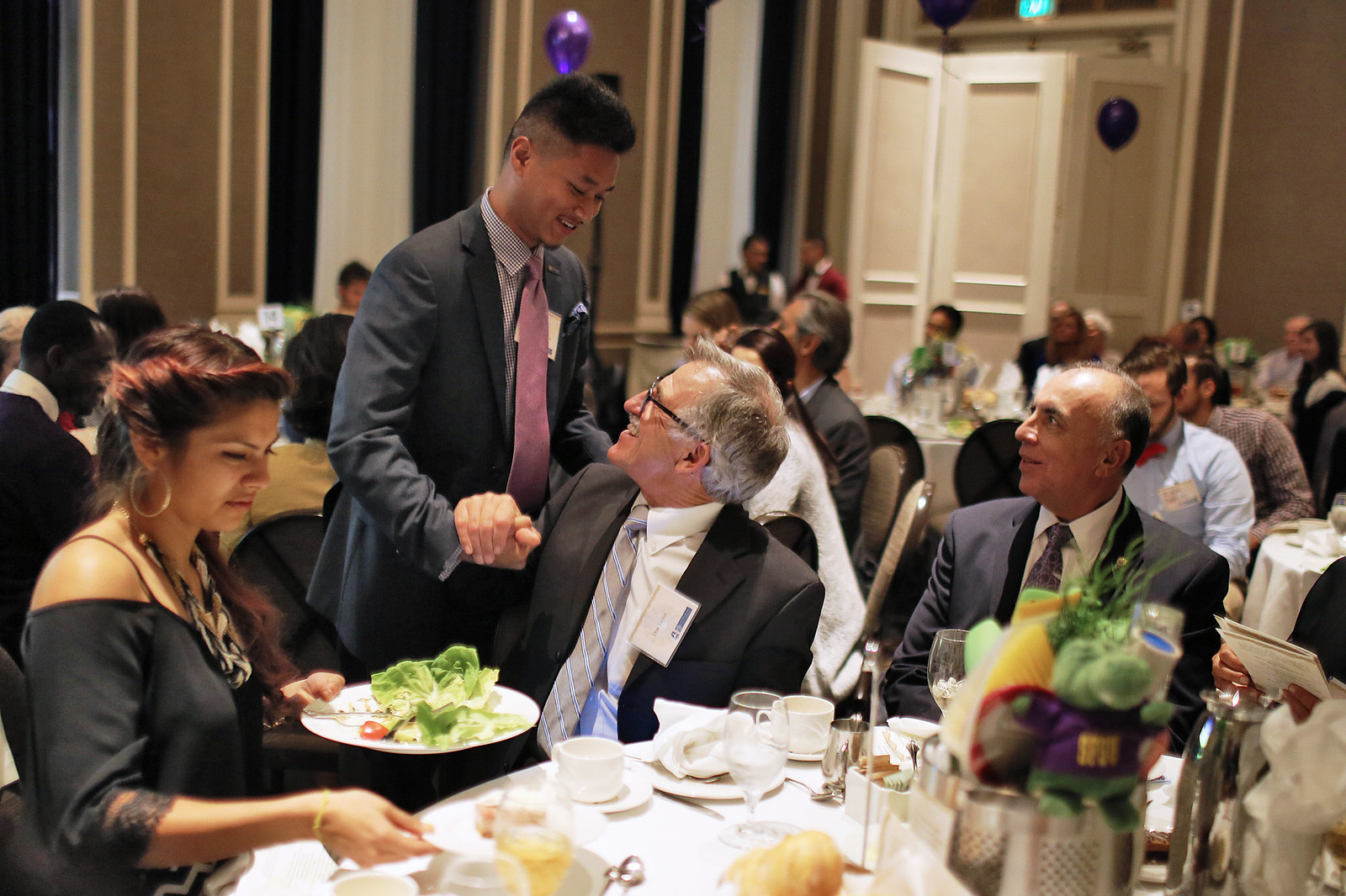 SF State alumni Sokhom Mao shakes hands with SF State Dean Don Taylor after Mao's speech during the5th annual Guardian Scholars Program Luncheon at the Sir Frances Drake Hotel on Oct 18. The Guardian Scholars Program is a SF State organization designed to help children in the foster care system transition into college life. Students in the Guardian Scholars Program have an 85 percent graduation rate. Photo by John Ornelas / Xpress