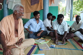 The Executive Committee of the Thalambedu Vayalagam meets outside a temple in the village