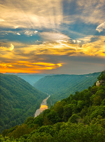 sunset sky orange mountains color nature water clouds forest river landscape outdoors us scenery colorful unitedstates scenic nobody cliffs westvirginia valley gorge sunrays overlook height edmond sunbeams newriver newrivergorge beautymountain