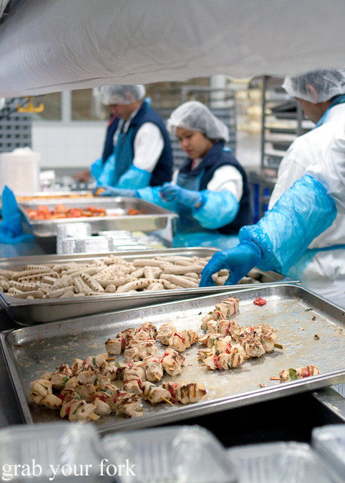 Chicken skewers and sausages during a behind-the-scenes tour of Emirates Flight Catering